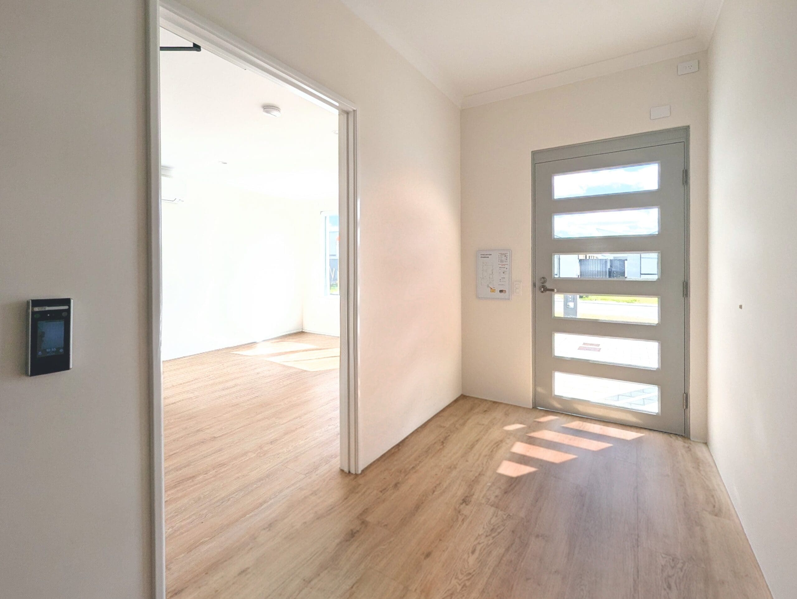 Accessible entryway in an SDA Property in Baldivis, featuring wide doorways, modern front door, and digital intercom, part of Australia’s leading disability accommodation provider.