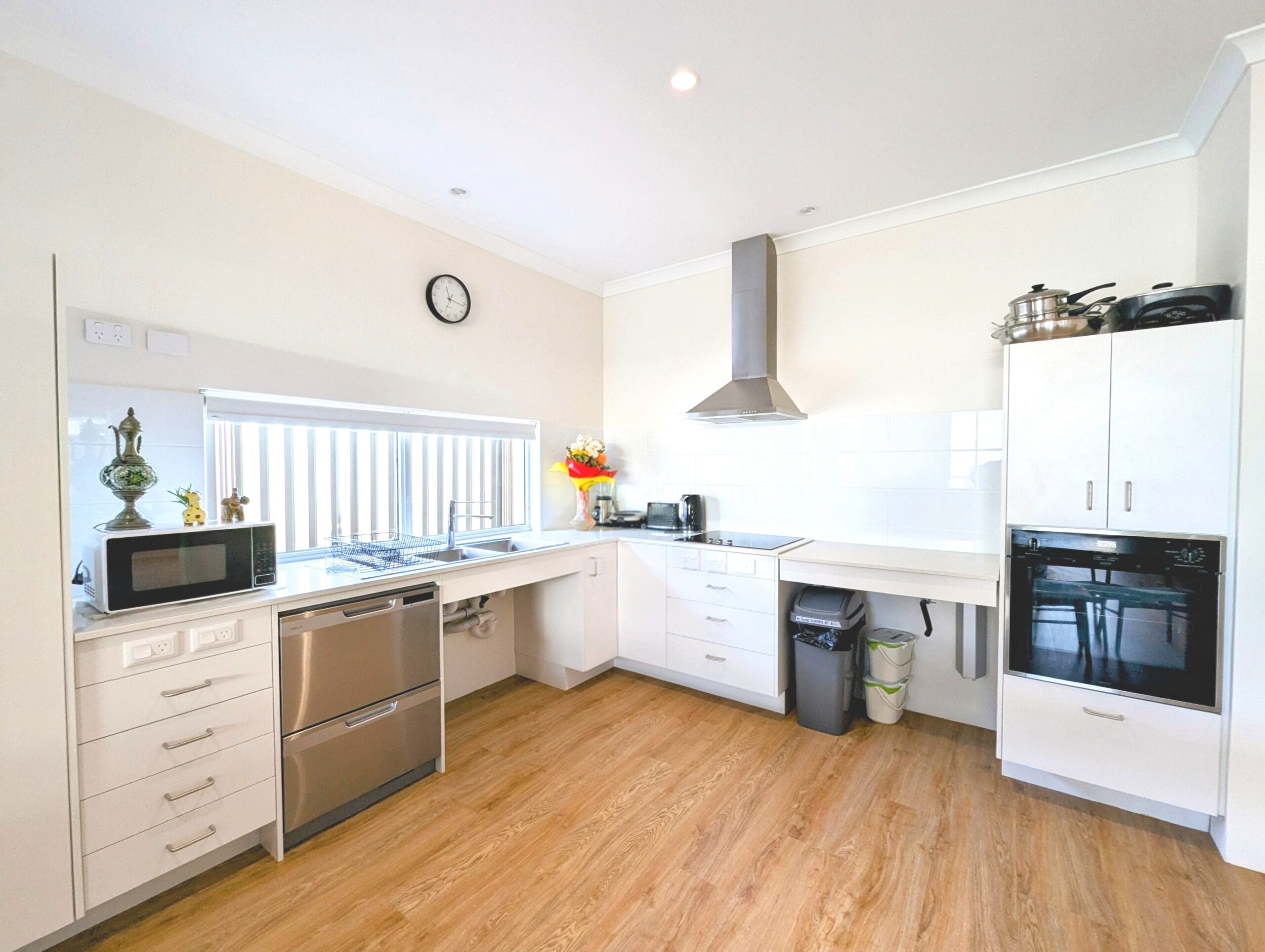 Modern, accessible kitchen in an SDA Property in Baldivis, featuring stainless steel appliances and ample counter space, part of Australia’s leading disability accommodation provider.