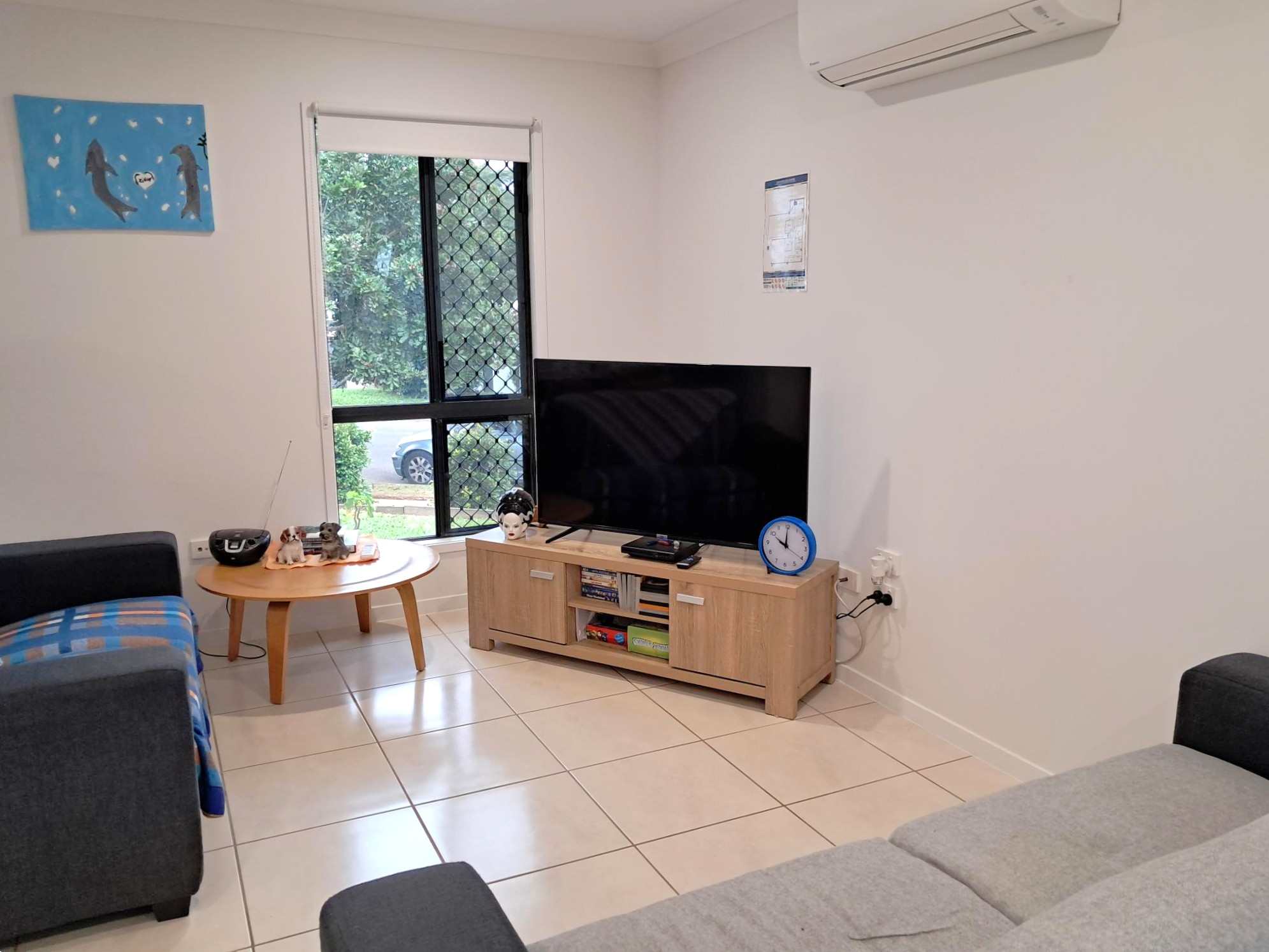 Comfortable and inclusive living room with TV, lounge seating, and natural light, suited for shared supported housing. From Australia’s leading disability and aged care service provider.