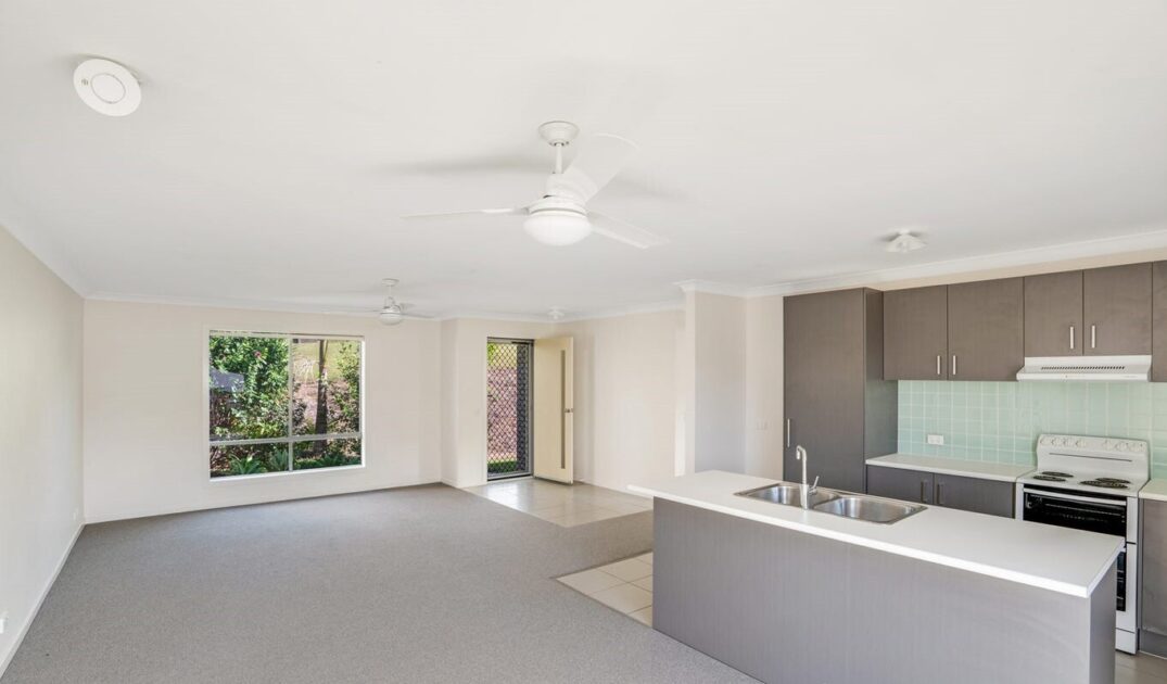 Entry way living and kitchen of Australia’s leading care accommodation provider with open-plan layout and modern finishes in Peaceful Southside.