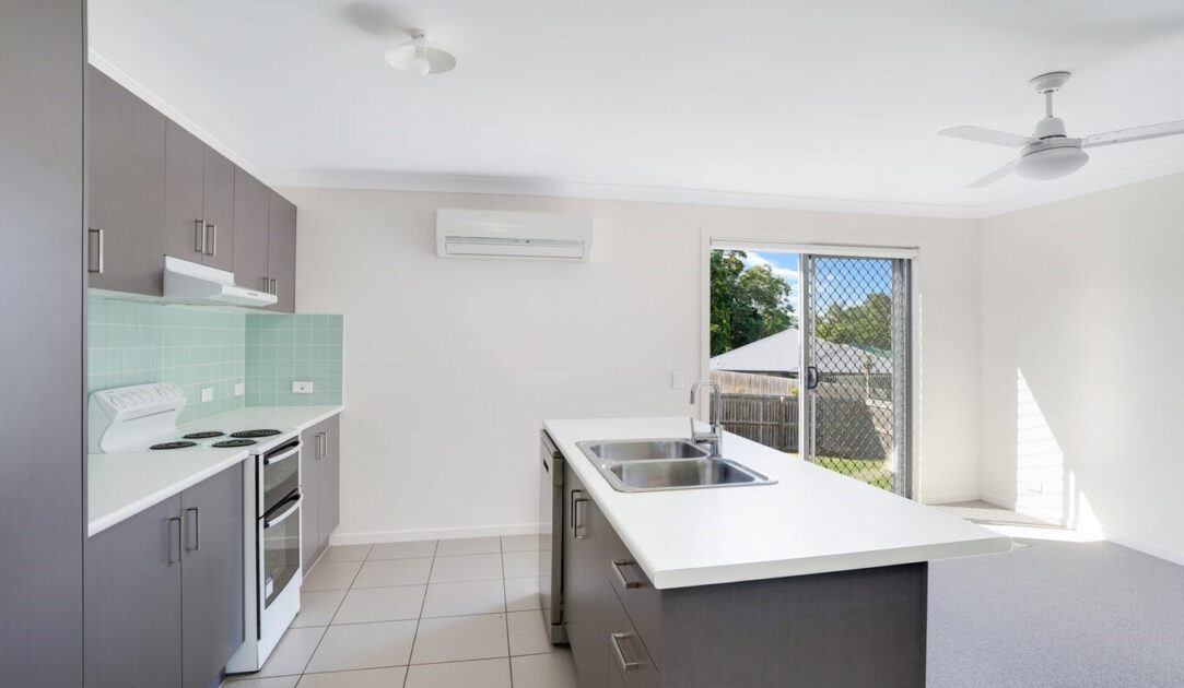 Light-filled kitchen with island bench at Australia’s leading care accommodation provider in 26 Bond Drive, Gympie Qld 4570.