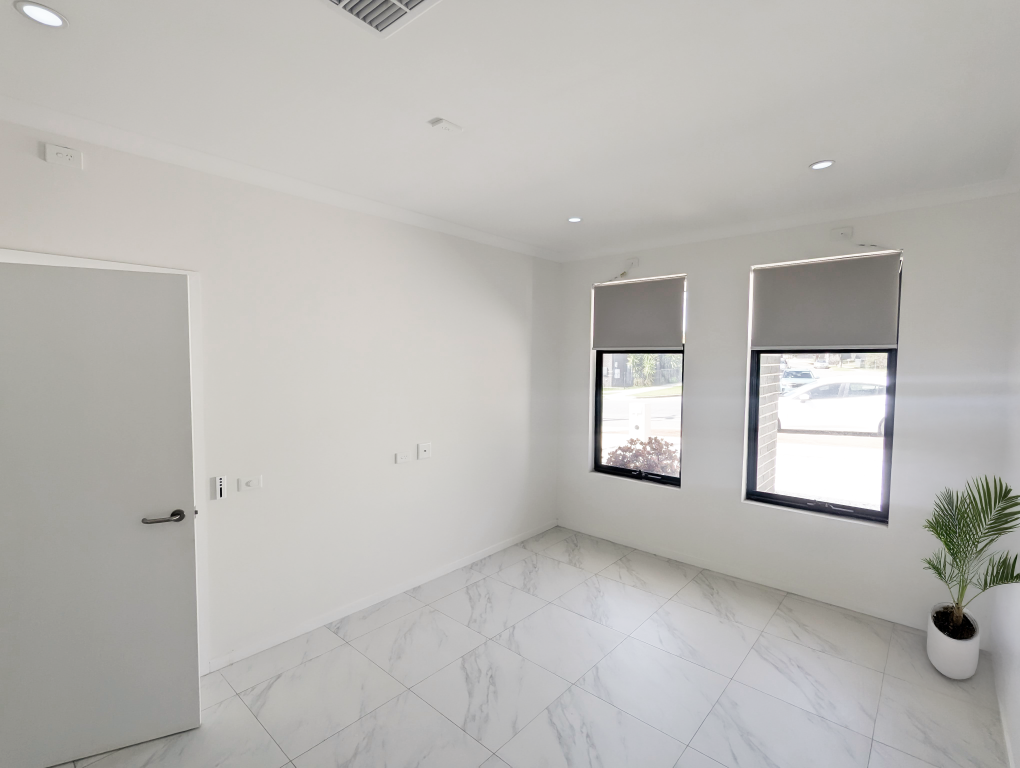 Spacious, accessible room in a Beautiful Brand New SDA Home in Christie Beach, featuring marble-effect tiles, large windows, and wide doorways, part of Australia’s leading disability accommodation provider.