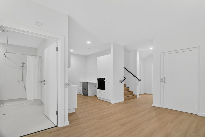 Spacious Kitchen and living, accessible interior of a High Physical Support SDA Villa in Fullarton, 3 1B Gladstone Street SA 5063, featuring light wood flooring, wide doorways, and seamless flow, part of Australia’s leading disability accommodation provider.