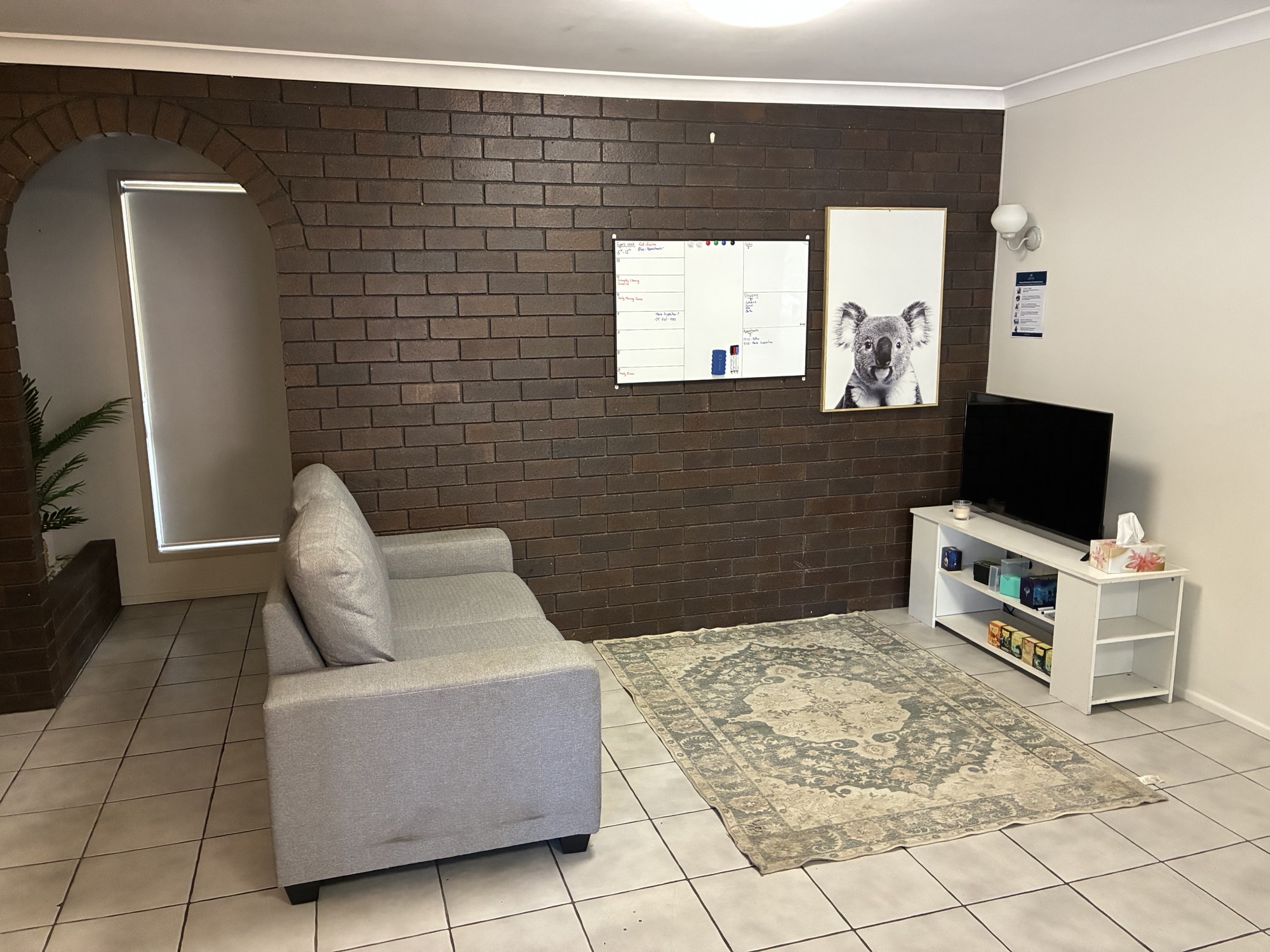 Cozy, accessible living area in a Spacious SIL Home in the Heart of Rockhampton, 23 O'Shanesy Street, Koongal Qld 4701, part of Australia’s leading disability accommodation provider.