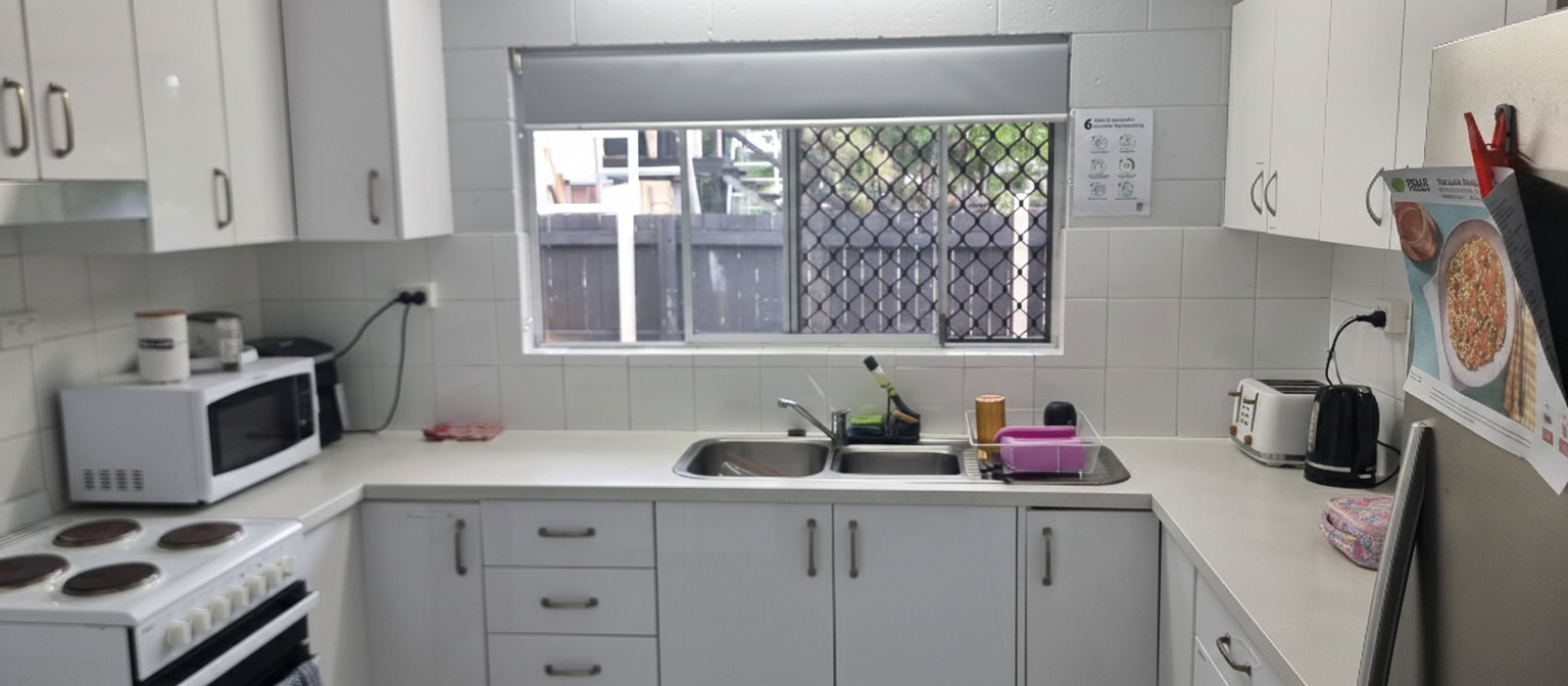 Functional, cozy kitchen in a Comfortable and Cozy SIL in Cairns, 48 Swallow St, Mooroobool Qld 4870, part of Australia’s leading disability accommodation provider.