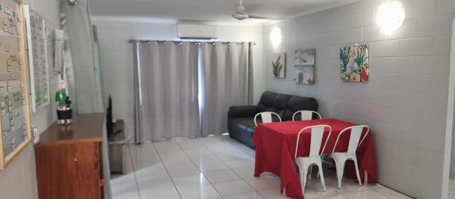 Cozy, accessible living and dining area in a Comfortable and Cozy SIL in Cairns, 48 Swallow St, Mooroobool Qld 4870, part of Australia’s leading disability accommodation provider.