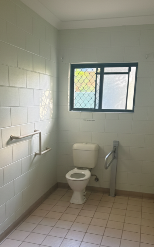 Accessible bathroom in a Central and Roomy SIL home in Mareeba, 6 Kylie Close, Mareeba 4880, featuring grab rails, level flooring, and security window, part of Australia’s leading disability accommodation provider