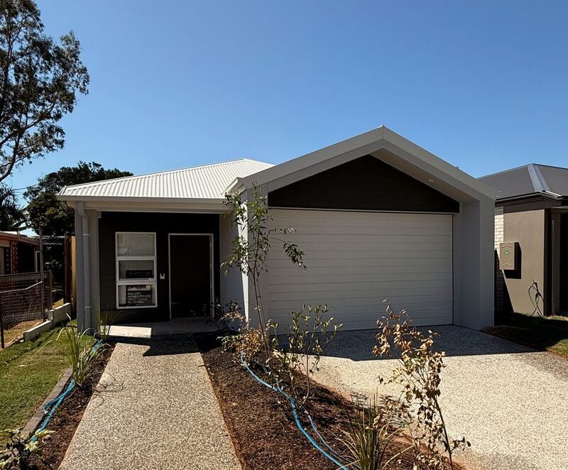 Modern exterior of Purpose-Built High Physical Support Living in Cleveland, Langdon Street, featuring accessible driveway, secure entry, and contemporary design, part of Australia’s leading disability accommodation provider.