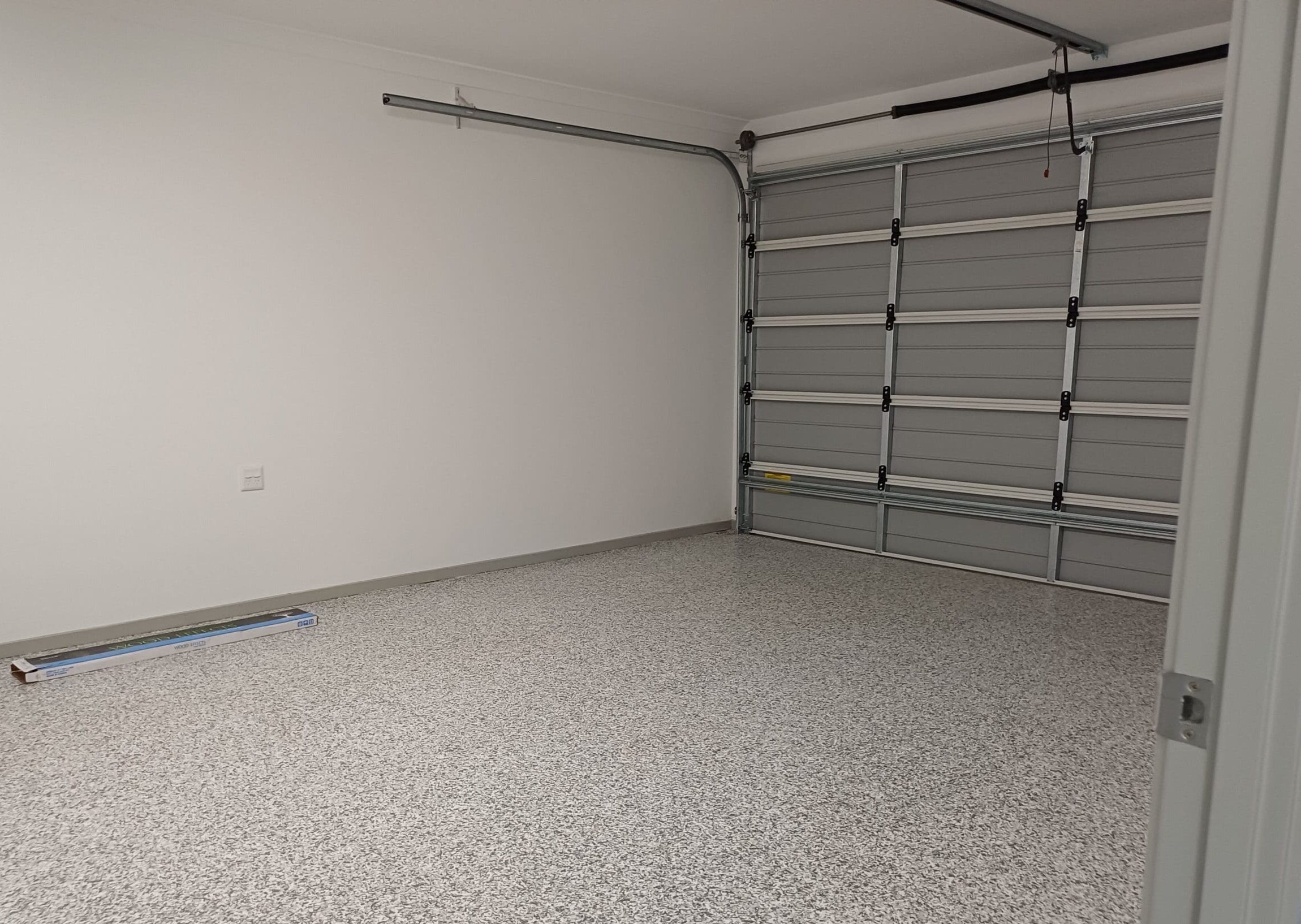 Accessible garage in Purpose-Built High Physical Support Living in Cleveland, Langdon Street, featuring epoxy flooring, wide entry, and safety features, part of Australia’s leading disability accommodation provider.